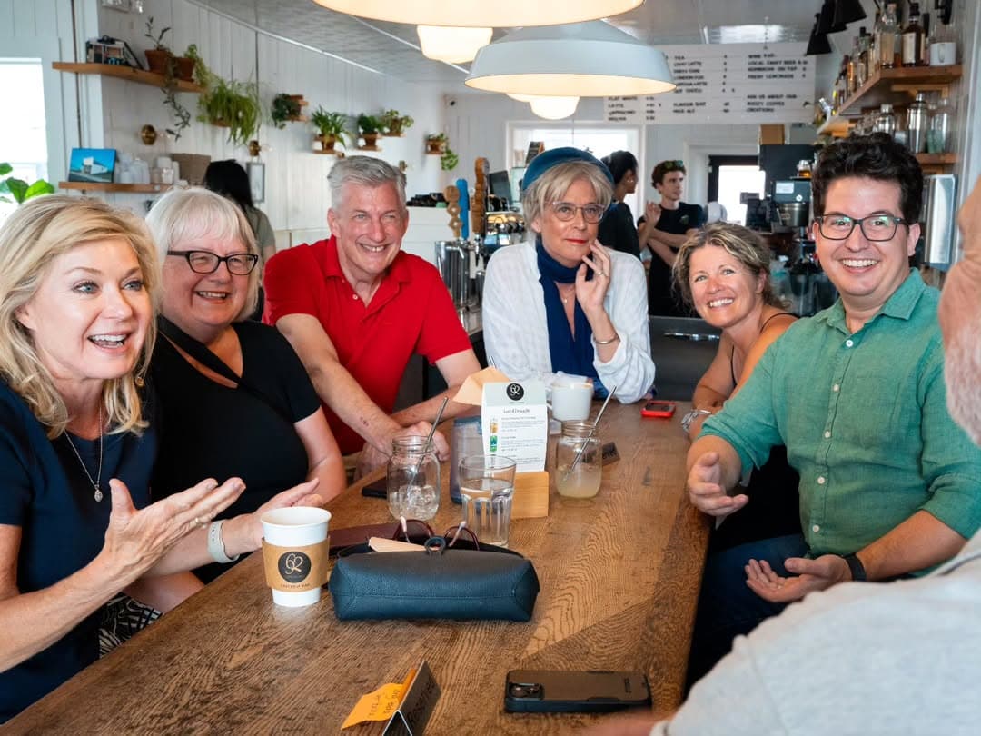 Brandon Bay and party members meeting with a local business owner