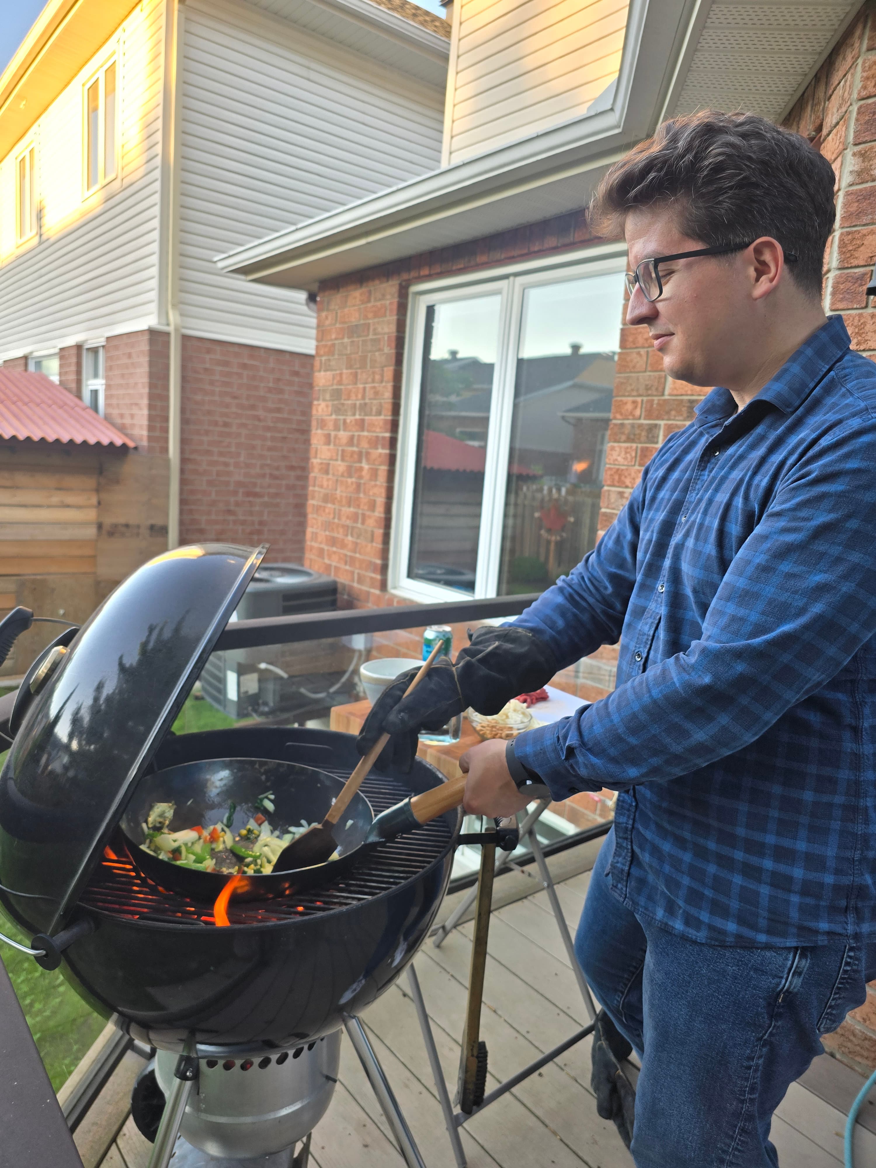 Cooking a stir-fry in a wok on a charcoal grill