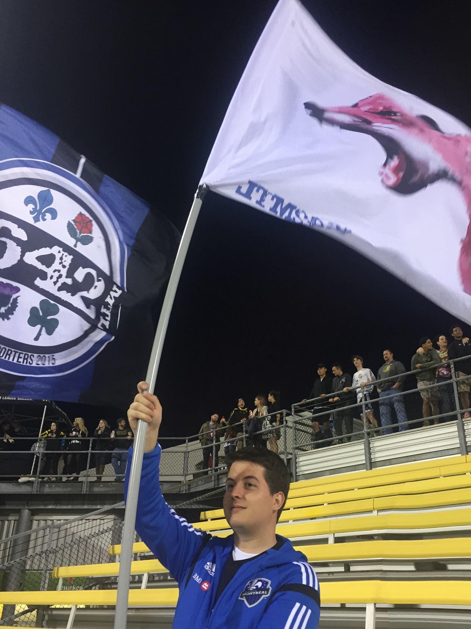Waving a fox flag for the Montreal Impact during an away match in Columbus