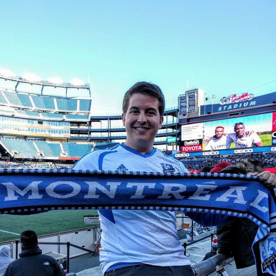Holding up a Montreal Impact scarf in Gillette Stadium