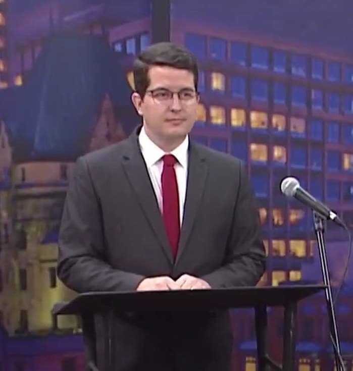 Brandon Bay at a Rogers TV provincial debate during the 2025 Carleton campaign