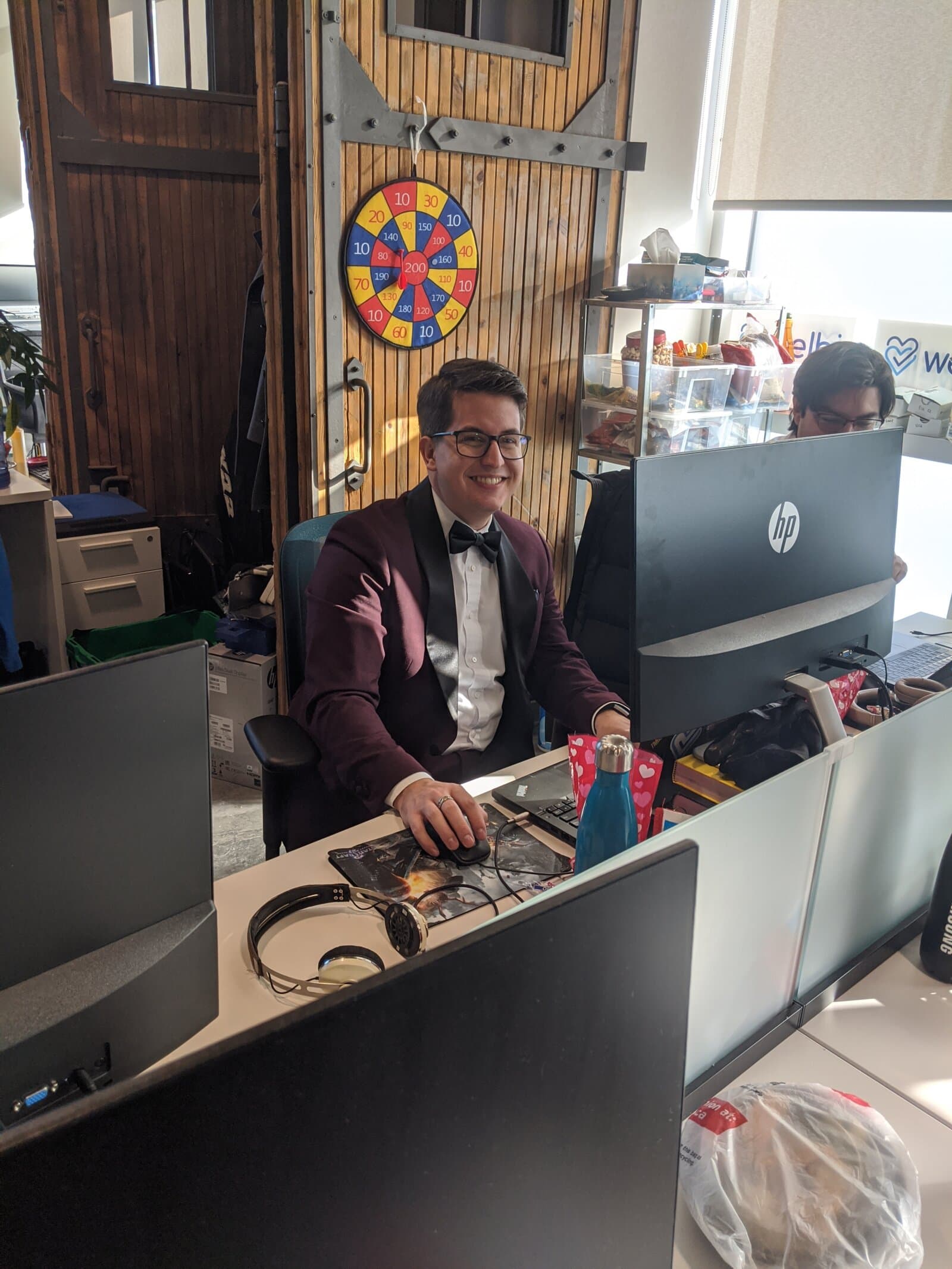 Brandon at the Welbi office in a tuxedo
